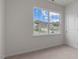 Bright bedroom with a large window offering neighborhood views and neutral carpet at 1014 Middlecrest Dr, Rocky Mount, NC 27804