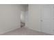 Bedroom entrance showing carpet and an adjacent doorway with hardwood flooring at 1014 Middlecrest Dr, Rocky Mount, NC 27804