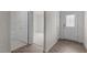 Bright hallway with hardwood floors leads to a bedroom and a front door with glass at 1014 Middlecrest Dr, Rocky Mount, NC 27804