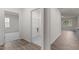 Hardwood hallway leading to a bedroom and laundry room at 1014 Middlecrest Dr, Rocky Mount, NC 27804