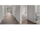 Bright hallway with hardwood floors leading to the bedrooms and bathroom at 1014 Middlecrest Dr, Rocky Mount, NC 27804