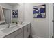 Well-lit bathroom featuring a double sink vanity and ample mirror space, creating a modern aesthetic at 1017 Middlecrest Dr, Rocky Mount, NC 27804