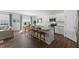 Open-concept kitchen featuring white cabinets, stainless steel appliances, and a granite island with barstool seating at 1017 Middlecrest Dr, Rocky Mount, NC 27804