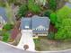 Aerial view of the property showing well-maintained landscaping and a two car garage at 102 Parkbranch Ln, Cary, NC 27519