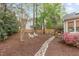 Spacious backyard featuring decorative rock bed and manicured landscaping at 102 Parkbranch Ln, Cary, NC 27519