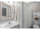 Bathroom featuring sink vanity, toilet and tub shower combo with decorative curtains at 102 Parkbranch Ln, Cary, NC 27519