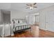 Spacious bedroom with hardwood floors and an open floor plan, offering ample space for relaxation at 102 Parkbranch Ln, Cary, NC 27519