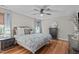 Relaxing bedroom with a ceiling fan, natural light and decorative lamps at 102 Parkbranch Ln, Cary, NC 27519