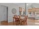 A charming dining room featuring wood trim and floors with an open living concept at 102 Parkbranch Ln, Cary, NC 27519
