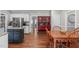 A transitional dining room and kitchen area featuring wood floors and trim at 102 Parkbranch Ln, Cary, NC 27519