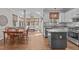 Open-concept kitchen with granite countertops, stainless steel appliances, and a dining area at 102 Parkbranch Ln, Cary, NC 27519