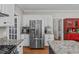 The kitchen features granite countertops, white cabinets, and stainless appliances at 102 Parkbranch Ln, Cary, NC 27519