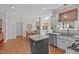 Kitchen area with a gray island, stainless dishwasher, granite countertops, and recessed lighting at 102 Parkbranch Ln, Cary, NC 27519
