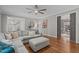 Inviting living room with hardwood floors, a sectional sofa, and access to other rooms at 102 Parkbranch Ln, Cary, NC 27519