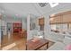 An open concept living room and dining room with wood floors and high ceilings at 102 Parkbranch Ln, Cary, NC 27519