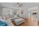 Inviting living room with hardwood floors, a sectional sofa, and access to other rooms at 102 Parkbranch Ln, Cary, NC 27519