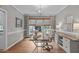Bright home office featuring hardwood floors, natural light, and modern decor at 102 Parkbranch Ln, Cary, NC 27519