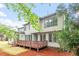 The back exterior has a deck overlooking a manicured lawn at 103 Caymus Ct, Cary, NC 27519