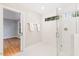 Bright bathroom boasts a glass-enclosed shower, white tiling, and modern fixtures at 103 Caymus Ct, Cary, NC 27519