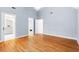 Bright bedroom with hardwood floors and ensuite bathroom access, offering comfort and privacy at 103 Caymus Ct, Cary, NC 27519