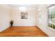 Bright bedroom featuring hardwood flooring, neutral paint, and large windows at 103 Caymus Ct, Cary, NC 27519