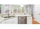 Stylish kitchen featuring stainless steel appliances, granite counters, and a large window at 103 Caymus Ct, Cary, NC 27519