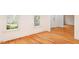 Inviting living area filled with natural light, hardwood floors, and neutral paint at 103 Caymus Ct, Cary, NC 27519