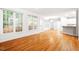 Spacious living room featuring hardwood floors, natural light, and an open floor plan at 103 Caymus Ct, Cary, NC 27519