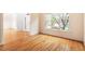 Bright living room with hardwood floors, large windows, and plenty of natural light at 103 Caymus Ct, Cary, NC 27519