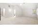 Spacious main bedroom with neutral carpet, and a window providing natural light at 103 Caymus Ct, Cary, NC 27519