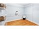 Well-organized walk-in closet with ample shelving and hardwood flooring; great for storage at 103 Caymus Ct, Cary, NC 27519