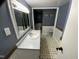 Well-lit bathroom with modern vanity, mosaic tile accents, and framed mirror, creating a fresh, clean aesthetic at 104 N 16Th St, Erwin, NC 28339