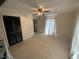 Cozy bedroom featuring a neutral color scheme, ceiling fan, and closet space at 104 N 16Th St, Erwin, NC 28339