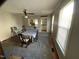 Dining room with window views, ceiling fan, and ample natural light for enjoyable meal settings at 104 N 16Th St, Erwin, NC 28339