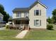 Charming two-story home featuring a well-maintained lawn, inviting front porch and traditional architectural details at 104 N 16Th St, Erwin, NC 28339