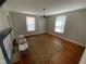 Living room boasts hardwood floors, natural light, and a decorative fireplace mantel adding character at 104 N 16Th St, Erwin, NC 28339