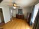 Main bedroom features hardwood floors, ceiling fan, closet, and abundant natural light, creating a serene retreat at 104 N 16Th St, Erwin, NC 28339