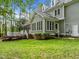 A spacious backyard features a screened-in porch and a deck for outdoor entertaining at 105 Toynbee Pl, Chapel Hill, NC 27514