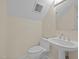A clean, bright bathroom offers a pedestal sink, toilet, and overhead lighting at 105 Toynbee Pl, Chapel Hill, NC 27514