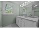 Bright bathroom with double vanity, large mirror, and natural light at 105 Toynbee Pl, Chapel Hill, NC 27514