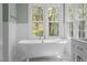 Charming bathroom with soaking tub and serene outdoor views at 105 Toynbee Pl, Chapel Hill, NC 27514