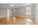 Spacious bedroom features hardwood floors, crown molding, natural light, and ceiling fan at 105 Toynbee Pl, Chapel Hill, NC 27514