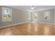 Spacious bedroom with neutral walls, hardwood floors, and ample natural light at 105 Toynbee Pl, Chapel Hill, NC 27514