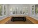 Dining room with natural light from large windows and beautiful hardwood flooring at 105 Toynbee Pl, Chapel Hill, NC 27514