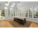 Sun-drenched dining room with skylights, ample windows and wood flooring at 105 Toynbee Pl, Chapel Hill, NC 27514