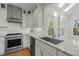 Kitchen area featuring stainless appliances, granite countertops and hardwood floors at 105 Toynbee Pl, Chapel Hill, NC 27514
