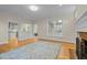Open concept living room with fireplace and hardwood floors that transition to kitchen at 105 Toynbee Pl, Chapel Hill, NC 27514