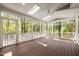 Spacious screened porch with skylights and wood flooring at 105 Toynbee Pl, Chapel Hill, NC 27514