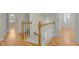 Second floor hallway view of staircase, and hardwood floors throughout at 105 Toynbee Pl, Chapel Hill, NC 27514