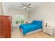 Bright bedroom with natural light, ceiling fan, and warm colored hardwood floors at 1109 Forest Willow Ln, Morrisville, NC 27560